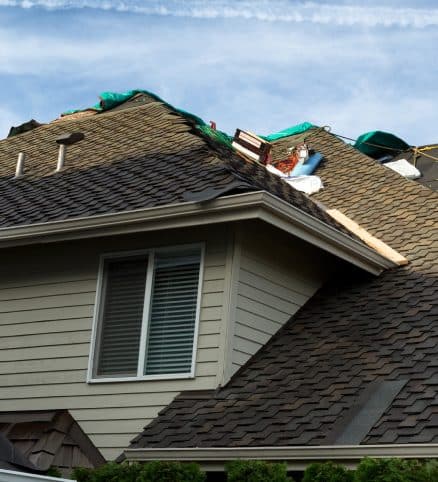 TurnKey Roofers installer fitting tile on a New Orleans roof