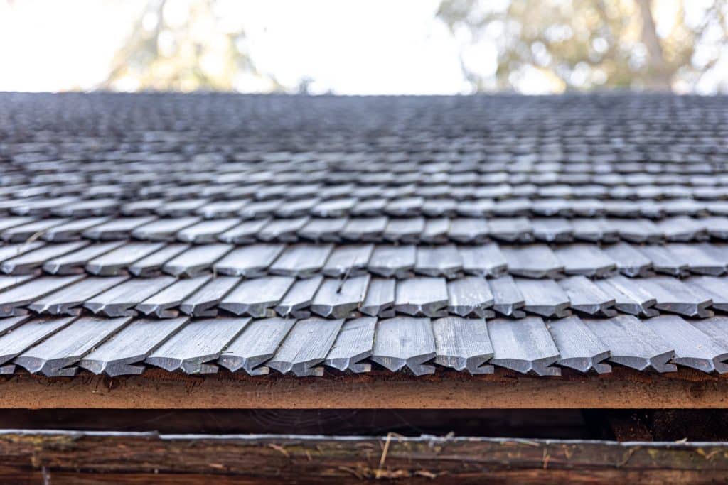 Close-up, the roof of a house made of wooden tiles.