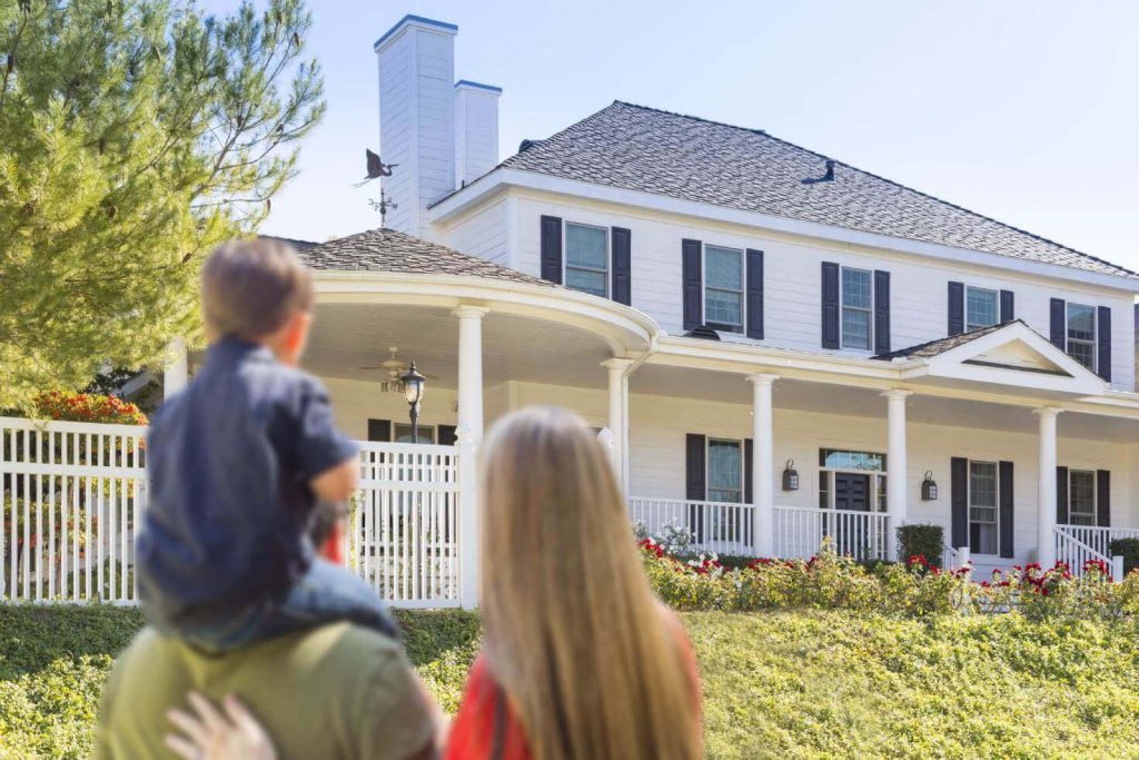 A Faimly in Front of a new home