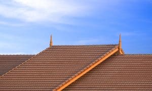 2 levels of brown ceramic tile roof in vintage sty - roofing